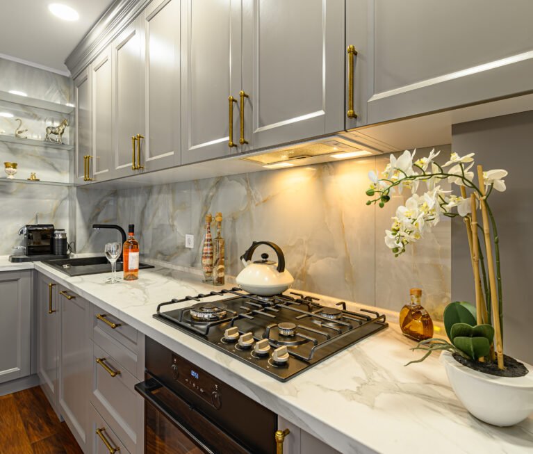 Closeup details of grey and white contemporary classic kitchen designed in modern style