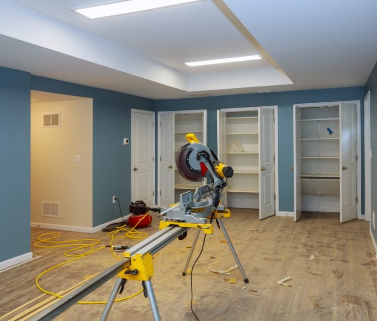 Cutting and nailing shoe molding using nail air gun and circular saw construction building industry