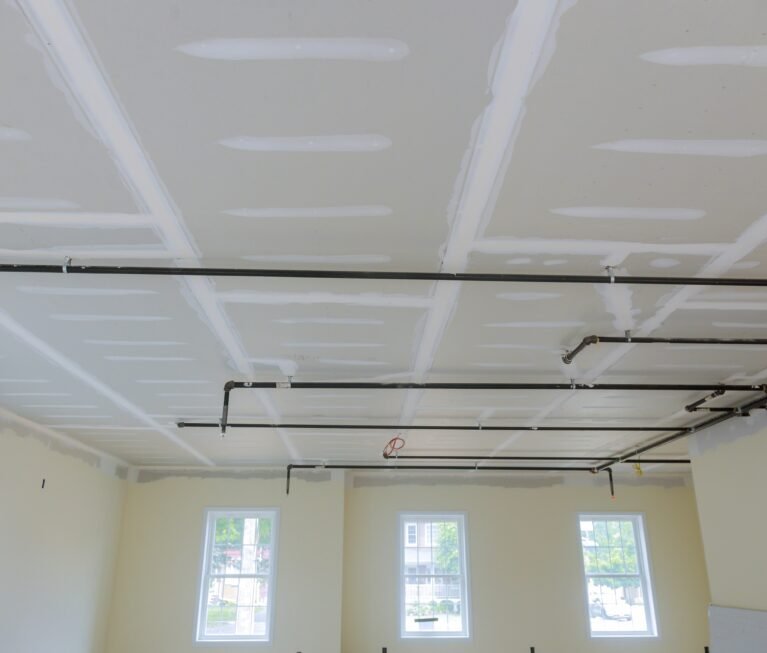 Fire sprinkler in automatic ceiling office building focus at selective on ceiling background