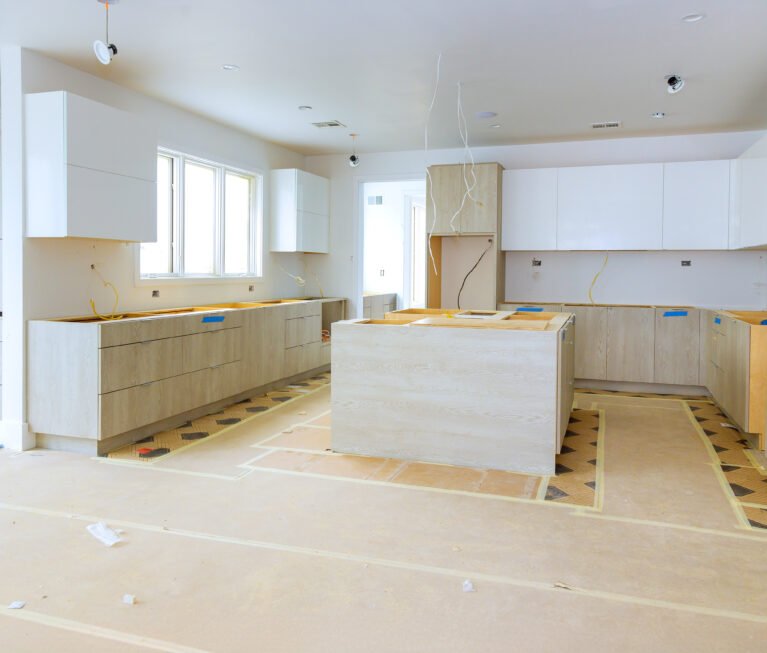 In process of constructing home improvement project, new custom kitchen cabinet is being assembled