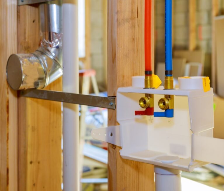 Interior framing of a plumbing outlet box for the laundry room in a new home under construction